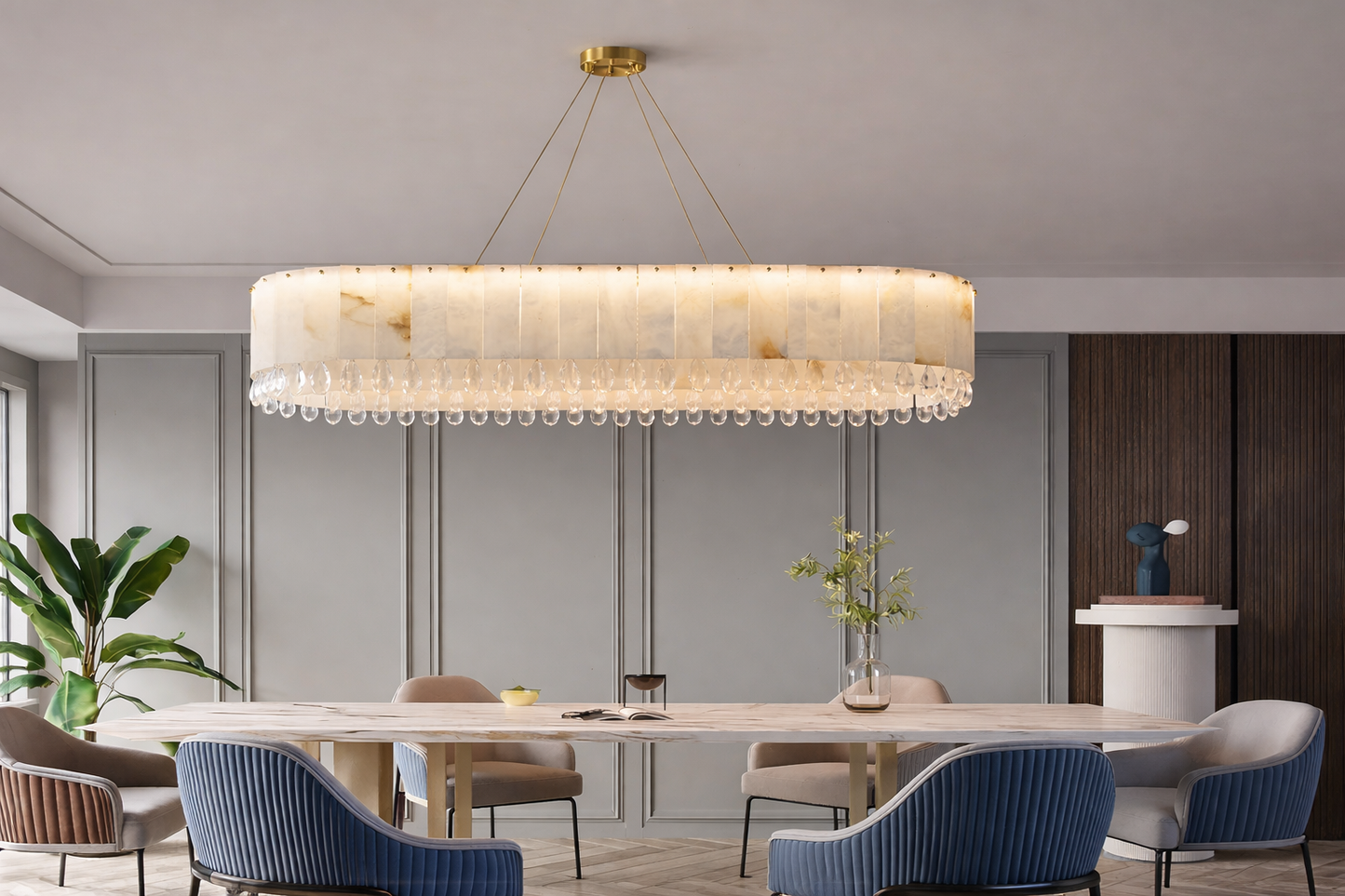 Modern marble chandelier sized correctly above round dining table in luxury interior