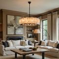 Brookhill Calcite Round Chandelier 31" illuminating a modern living room with elegant decor.