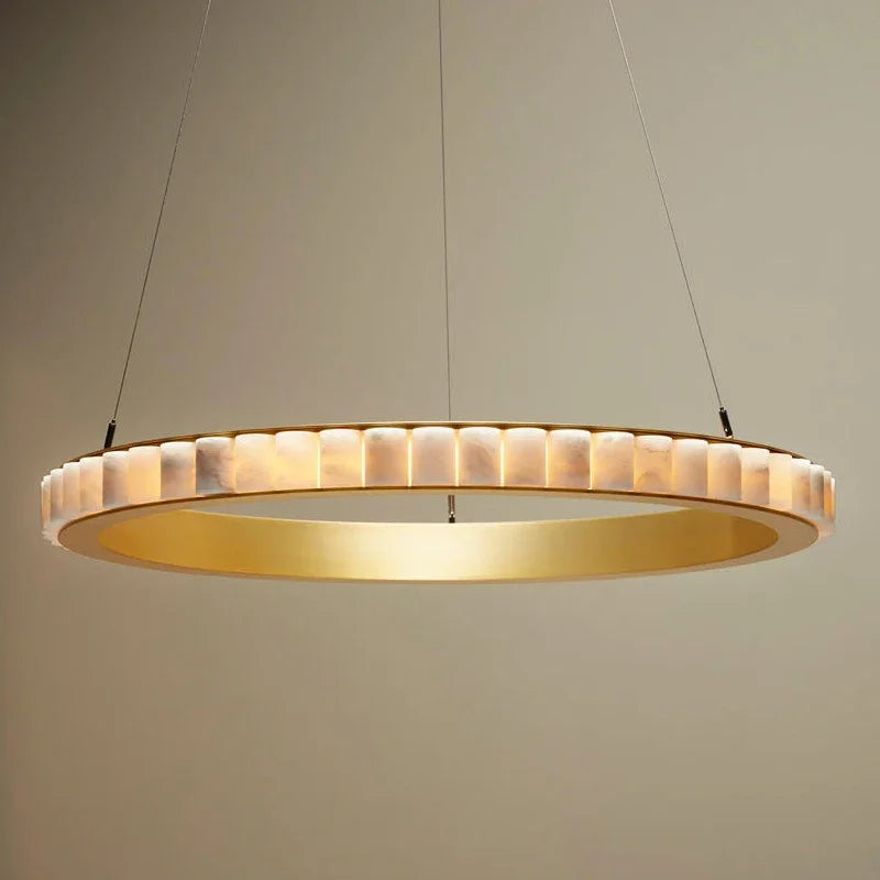 
                  
                    The Bigman Hampton Marble Chandelier features a modern circular design with integrated LED, a gold interior, and a textured translucent outer ring, suspended by thin wires against a neutral beige background.
                  
                