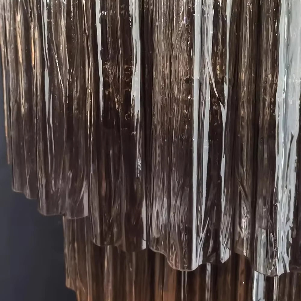 
                  
                    Close-up of a textured surface with vertical lines against a dark background
                  
                