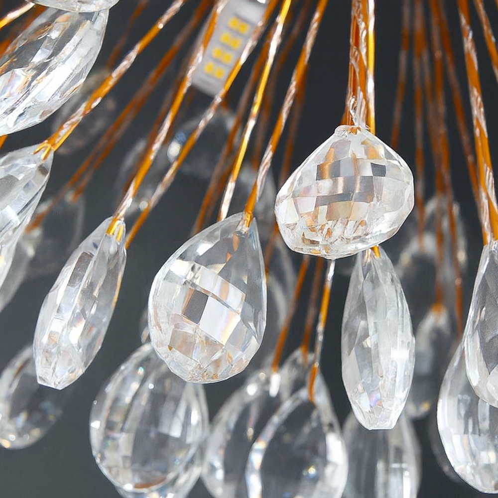 
                  
                    Close-up of the Vanci Crystal Globe Chandelier by Morsale.com, featuring teardrop-shaped crystal pendants on thin gold wires, reflecting light against a dark background. An LED strip adds to its elegant, modern chandelier design.
                  
                