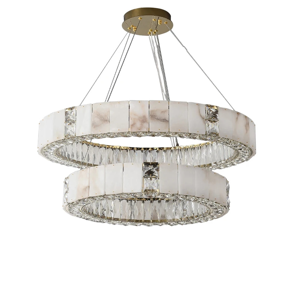 A luxurious chandelier featuring two concentric circular rings, the Natural Marble & Crystal Modern Ceiling Light Fixture by Morsale.com is adorned with vertically arranged rectangular pieces that resemble natural marble and clear crystals. The rings are suspended from a gold-colored ceiling plate by thin cables, perfect for luxury home décor.