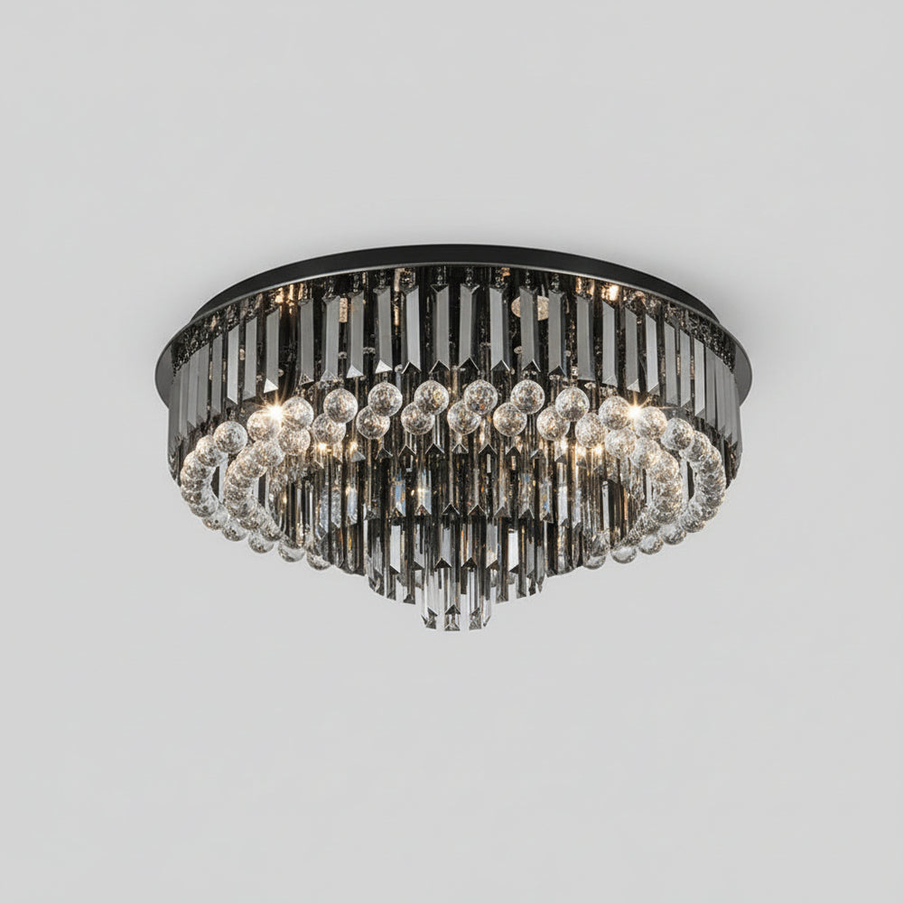 Chandelier hanging from a ceiling with a neutral background
