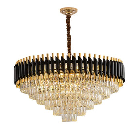 The Morsale.com Verano Crystal Chandelier is a luxurious fixture with a tiered design adorned with cascading crystal prisms, black and gold metal accents, and a twisted brown cord. Crafted from premium materials and equipped with a dimmable function, it radiates elegance as its internal bulbs create a sparkling effect.