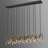 The 48-Light Dining Room Ceiling Light Fixture by Morsale.com boasts a sleek design with multiple vertical brass rods hanging at various lengths, each terminating in small individual G9 LED light bulbs. This contemporary chandelier is elegantly suspended from a rectangular ceiling mount against a plain gray background.