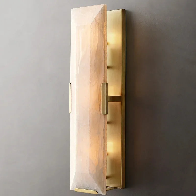 
                  
                    The Brookhill Calcite Wall Sconce by Morsale.com features a rectangular, faceted crystal shade on a brushed gold base, emitting warm light—an ideal modern wall light for any elegant space.
                  
                