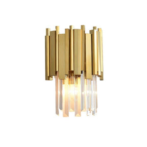 The Gio Crystal Wall Sconce by Morsale.com is a gold electroplated stainless steel wall-mounted light fixture featuring vertical rectangular elements and hanging crystal prisms. Illuminated by E14 LED bulbs, the fixture casts a warm glow. The logo "JASON" is in the top-left corner.