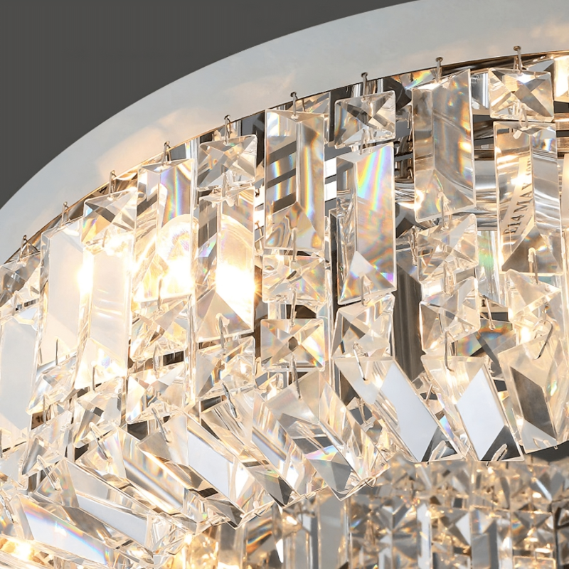 Close-up of the Specchio Crystal Ceiling Light Fixture by Morsale.com, featuring numerous rectangular and prism-shaped crystal pieces. These crystals reflect and refract light, creating a spectrum of colors and a dazzling effect. The dark gray background emphasizes the sparkle of this modern decor fixture.