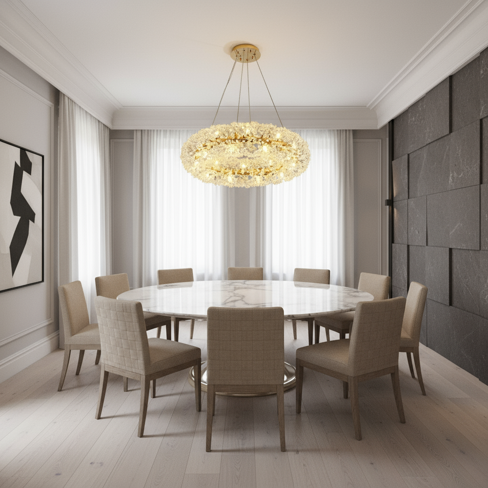 
                  
                    A modern dining room features a round marble table, eight beige chairs, light wood floors, abstract art on the wall, and the Leone Crystal Chandelier by Morsale.com overhead.
                  
                