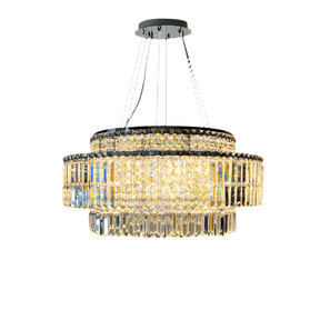 The Bacci Crystal Chandelier by Morsale.com showcases three tiers of rectangular crystals elegantly draped from a polished circular stainless steel frame. Suspended by four thin metallic wires, it radiates a warm glow through its intricate crystal design, enhanced with energy-efficient LED bulbs for a contemporary flair.