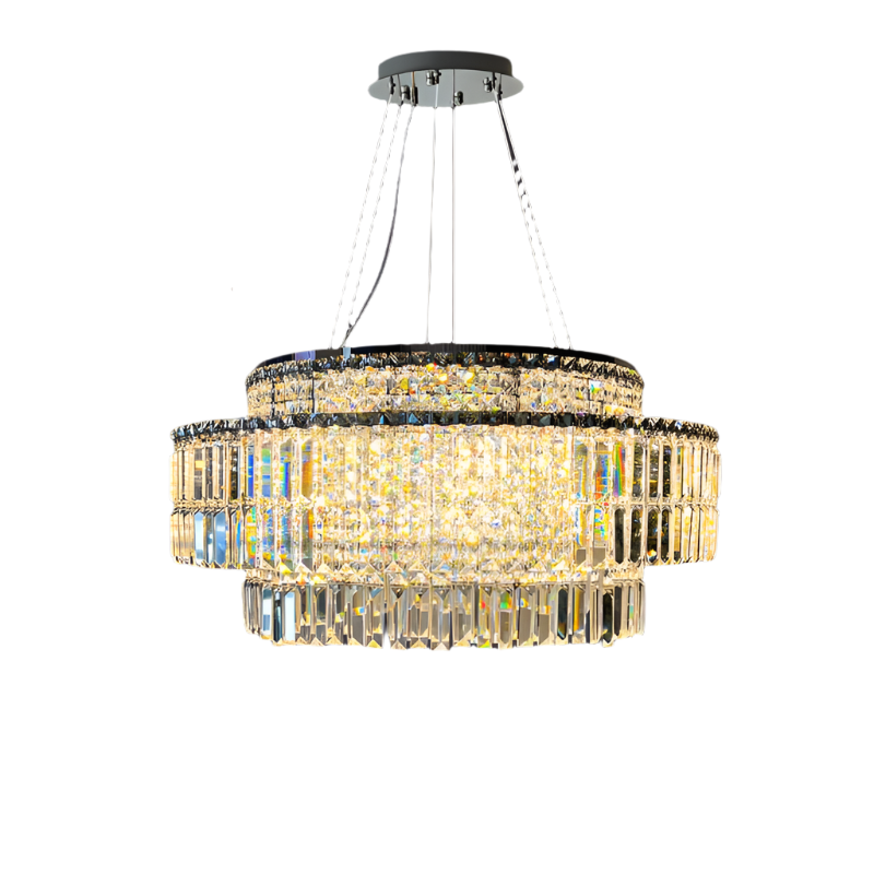 The Bacci Crystal Chandelier by Morsale.com showcases three tiers of rectangular crystals elegantly draped from a polished circular stainless steel frame. Suspended by four thin metallic wires, it radiates a warm glow through its intricate crystal design, enhanced with energy-efficient LED bulbs for a contemporary flair.