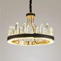 The Villa Crystal Chandelier by Morsale.com features a modern circular gold frame with clear crystal prisms arranged vertically, suspended by a black cord against a light background.