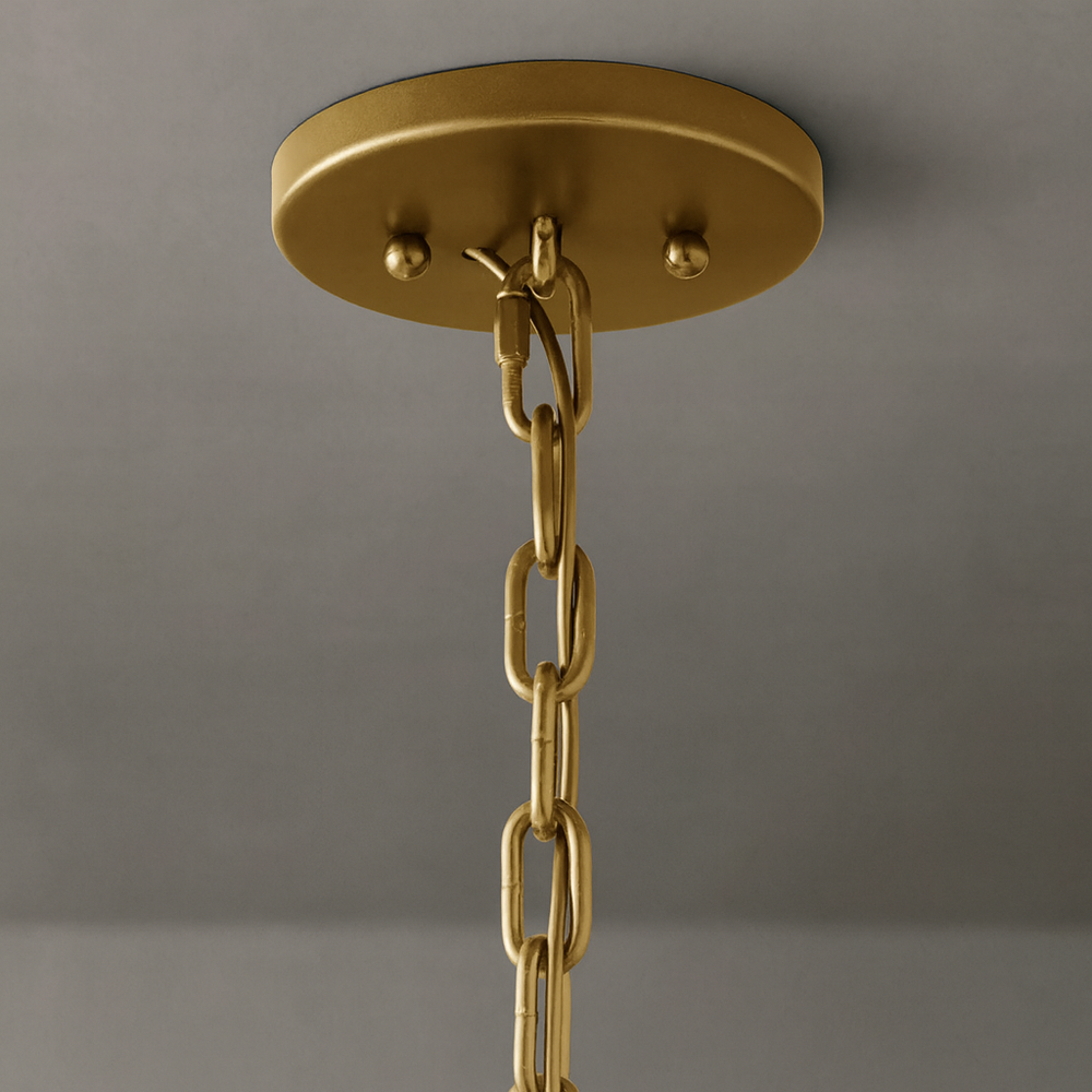 
                  
                    Close-up of a gold ceiling plate and matching chain for suspending the Villano Crystal Modern Chandelier by Morsale.com, secured with two screws on a plain gray ceiling—perfect for luxury lighting enthusiasts.
                  
                