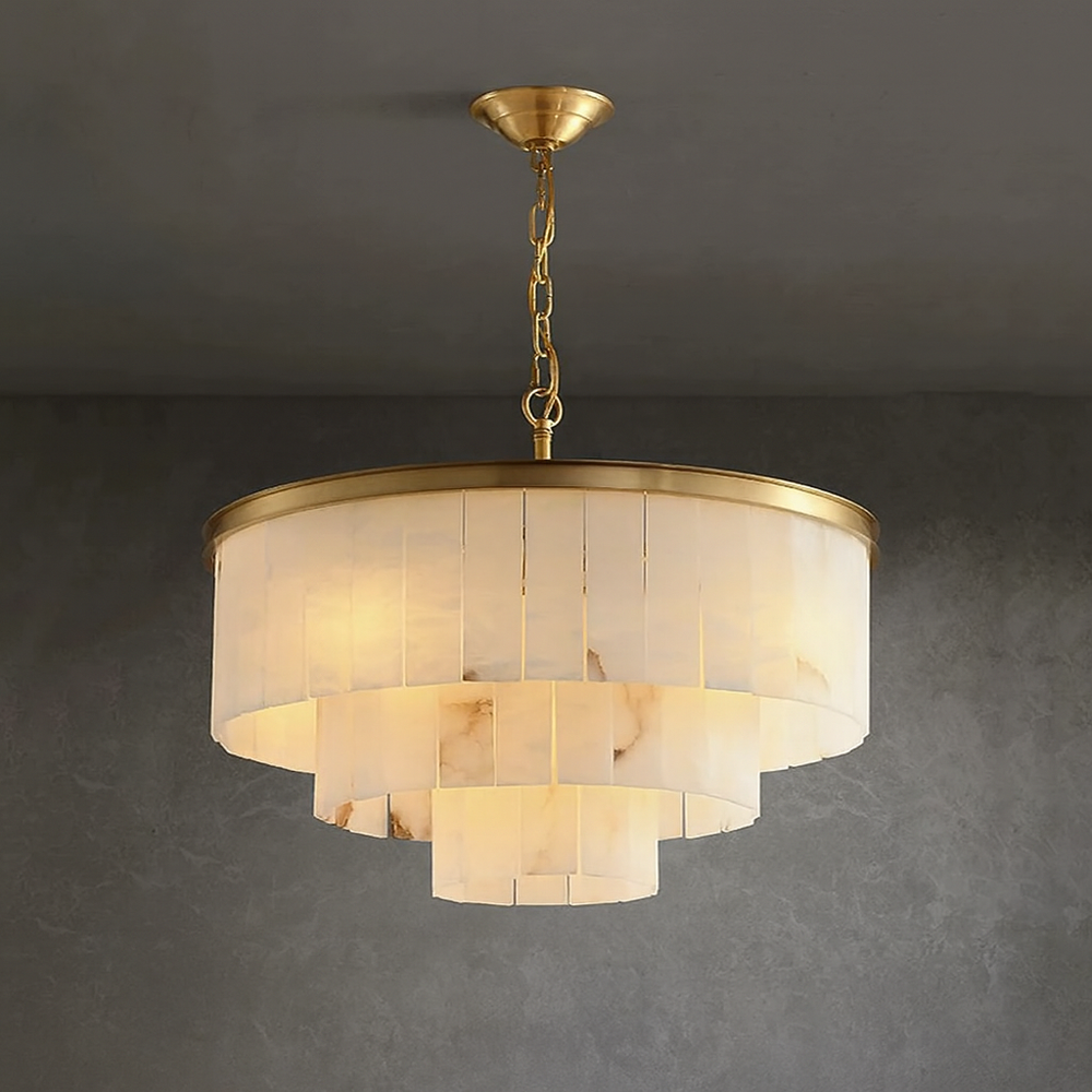 
                  
                    Elegant Aurora Marble Round Chandelier with polished brass frame, creating ambient light in a modern interior.
                  
                