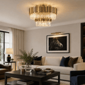 Modern living room with a chandelier, sofa, and decorative items.