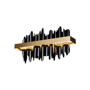 The Nera Brass Wall Sconce by Morsale.com is a modern LED wall fixture featuring a rectangular brushed gold finish frame with black sculptural elements extending both downward and upward, forming a jagged and abstract design. This light fixture seamlessly combines contemporary style with an artistic touch.