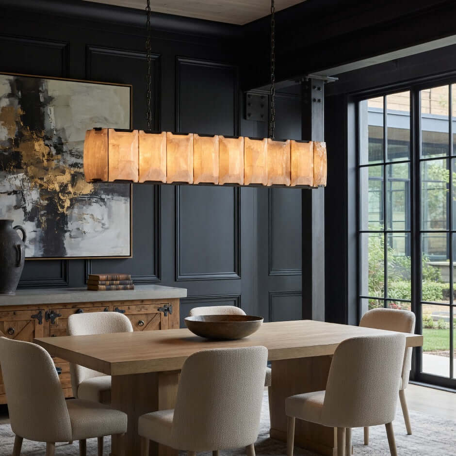 Brookhill 47" Calcite Linear Rectangular Chandelier hanging above a modern dining table in an elegant room.