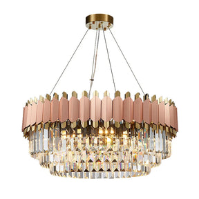 A luxurious Morsale.com Gio Rose Gold Modern Chandelier with gold and pink accents hangs from the ceiling. It features multiple rows of handcrafted crystals that reflect light, creating a dazzling effect. The frame is elegantly designed with a combination of gold and pink hues.