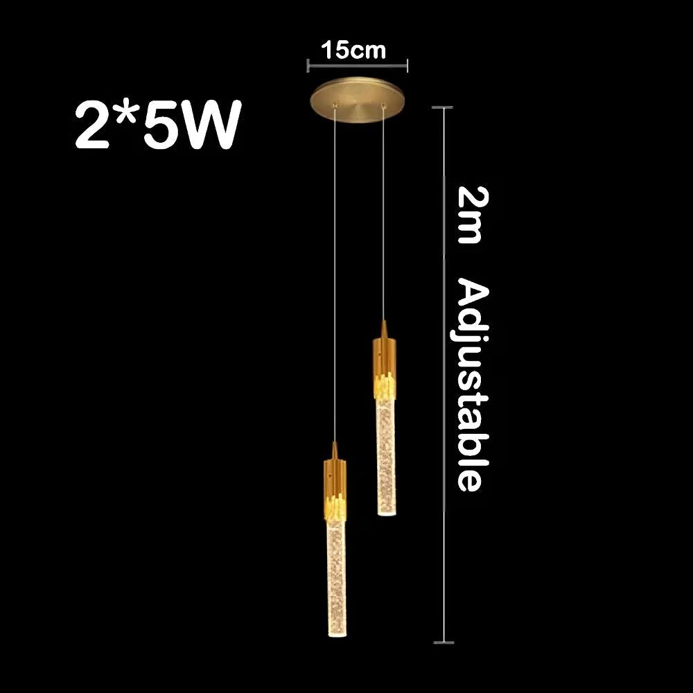 Image of a polished gold Modern Minimalist LED Pendant Light by Morsale.com with two vertical, cylindrical lights hanging from a round ceiling mount. The length of the cords is adjustable up to 2 meters, and each dimmable LED light is rated at 5W. The ceiling mount has a diameter of 15 cm.