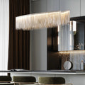 47" Cadena Dining Room Chandelier with stainless steel tassels, perfect for modern dining spaces.