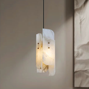 The Morsale Moonshade Natural Marble Pendant Lights boast a contemporary artistic design with layered white, translucent materials, potentially glass or acrylic, secured by small metallic fasteners. Ideal for interior design aficionados, they cast a gentle glow on the neutral walls akin to other marble pendant lights.