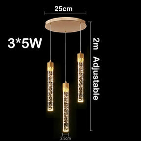 A Modern Minimalist LED Pendant Light from Morsale.com featuring three hanging cylindrical lights, each with polished gold accents and illuminated lower sections. The dimmable LED fixture has a round base measuring 25 cm in diameter, with adjustable lights up to 2 meters in length. Each light is 3.5 cm wide and 5W.