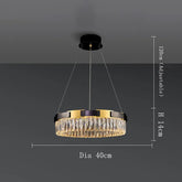 The Siena Contemporary Crystal Light Fixture by Morsale.com is a luxurious pendant mount chandelier measuring 40 cm in diameter and 14 cm in height. Suspended from a ceiling mount by three adjustable cables (up to 120 cm), it features gold accents and vertical crystal elements, making it an elegant lighting fixture.