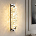 Elegant Golford Crystal Wall Sconce with warm illumination and handmade crystals, enhancing room aesthetics and décor.