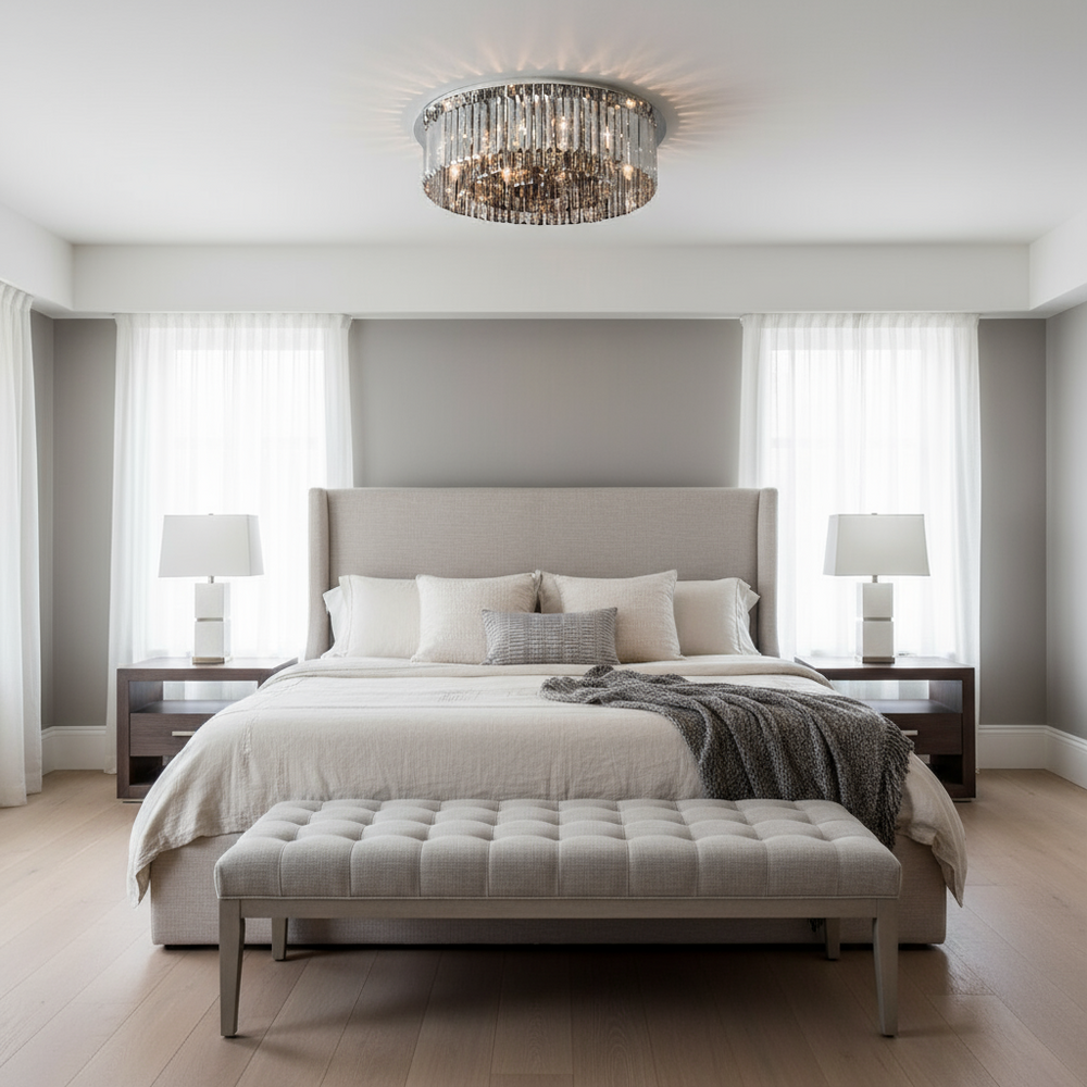 
                  
                    Modern bedroom with a large bed, ottoman, and decorative lighting.
                  
                