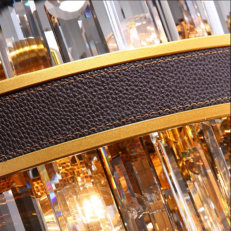 Close-up of an intricate object with a textured dark brown strip, bordered by golden bands. Behind the strip, there are overlapping vertical transparent glass or crystal elements reflecting light, creating a sparkly and luxurious appearance, reminiscent of the Calvi Modern Chandelier by Morsale.com.