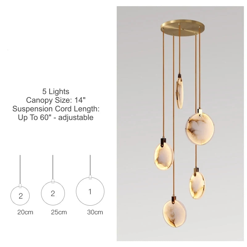 
                  
                    Modern pendant light with gold fixtures and glass shades on a gray background
                  
                