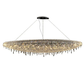 The Alleri Crystal Chandelier For Dining Room by Morsale.com is a large, oval-shaped fixture that gracefully hangs from the ceiling with thin wires. It boasts numerous small, handmade crystals that create a shimmering effect, with some crystals elegantly hanging down in strands. The sophisticated design is illuminated by E14 LED bulbs for a dazzling display.