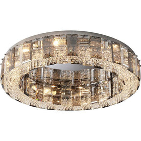 The Lancia Crystal Ceiling Light Fixture by Morsale.com is a modern, circular light fixture featuring a metallic rim adorned with handmade rectangular and square crystals. With an adjustable chain height, multiple bulbs cast a warm, refractive glow through the crystals, creating an elegant and luxurious appearance.