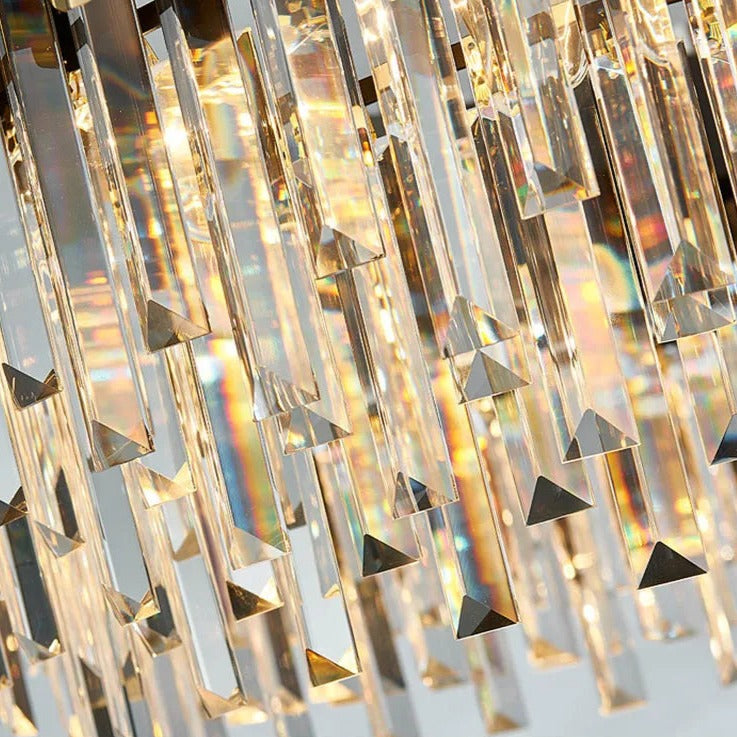 Close-up of an elegant Gio 39" Crystal Dining Room Chandelier by Morsale.com with numerous elongated, prism-shaped glass pieces reflecting light in a rainbow of colors. The crystals hang densely, creating a luxurious and sparkling effect that elevates any dining room with its elegant design. Text at the bottom reads "High quality crystal.