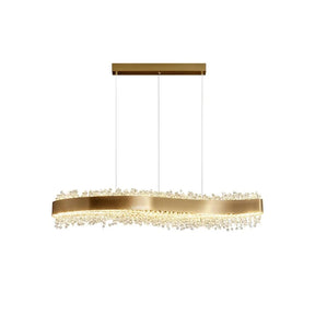 The Capri Crystal Dining Room Chandelier from Morsale.com showcases a sophisticated, contemporary design with a gold, wavy, rectangular framework embellished with countless small crystal-like beads. Equipped with LED strips for added brilliance, it is elegantly suspended by two thin cables connected to a rectangular gold plate on the ceiling against a plain white background.