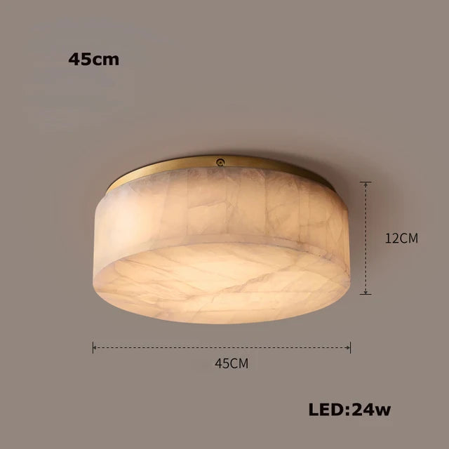 The Moonshade Natural Marble Ceiling Light Fixture by Morsale.com is a circular ceiling light with a 45cm diameter and 12cm height. It features a semi-translucent natural marble appearance that allows light to glow through, creating an elegant ambiance. The polished finish enhances its sophistication, while the energy-efficient 24-watt LED lights ensure lasting brightness.