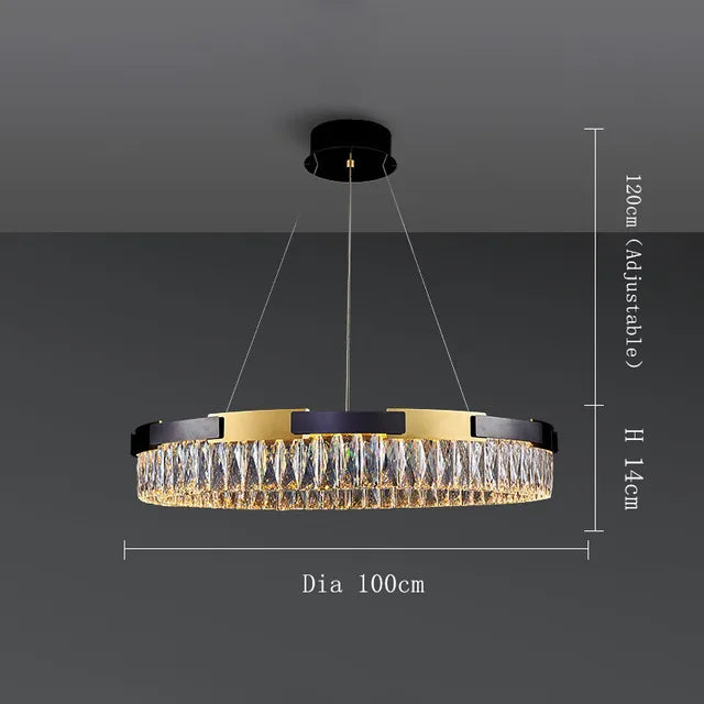 A modern Siena Contemporary Crystal Light Fixture from Morsale.com is hanging from the ceiling. This luxurious pendant mount chandelier features black and gold accents with intricate, hanging crystal pieces. Dimensions are indicated: diameter is 100 cm, height is 14 cm, and it is adjustable up to 120 cm.