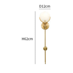 A sleek, modern wall sconce with a round white glass shade and brass finish. The Natural Marble Wall Light Sconce by Morsale.com measures 62 cm in height and 12 cm in diameter. This genuine marble sconce features an elongated, minimalist design suitable for contemporary decor, equipped with an E14 base LED.