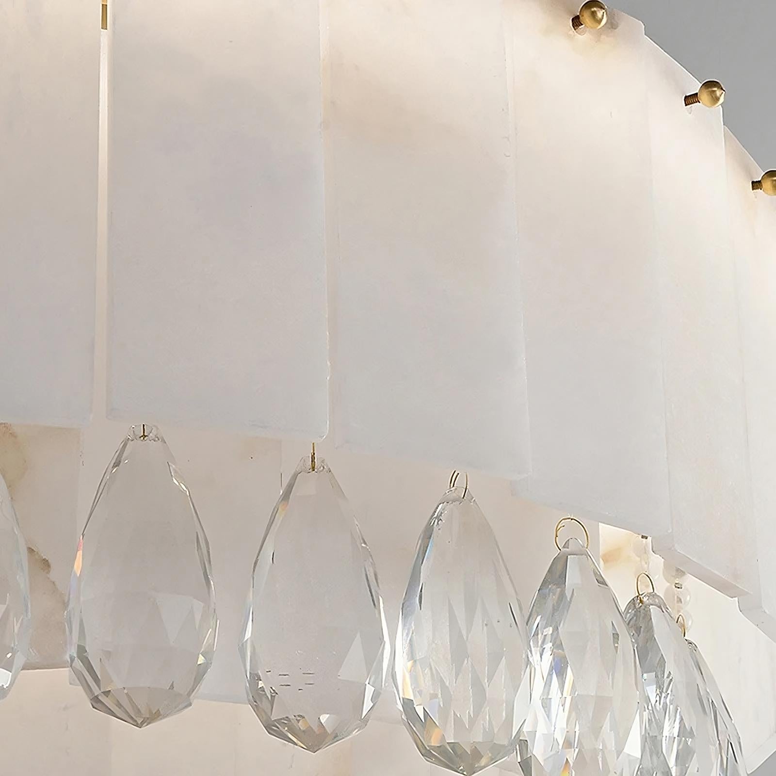 Close-up of the Modern Crystal and Spanish Marble Chandelier by Morsale.com, featuring white rectangular panels and multiple hanging teardrop-shaped crystals. Each crystal has a faceted surface, reflecting light and creating a shimmering effect. This elegant home decor piece boasts a minimalist yet luxurious design.