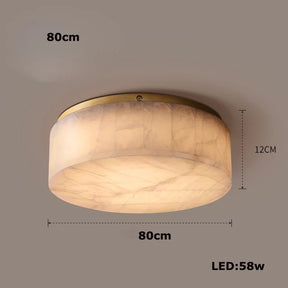 The Moonshade Natural Marble Ceiling Light Fixture by Morsale.com is a round, flush-mount ceiling light with an alabaster finish. It measures 80 cm in diameter and 12 cm in height, featuring energy-efficient LED lights that consume 58 watts of power. This fixture provides a soft, warm glow and has a smooth, wide cylindrical shape.