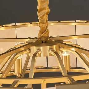 A close-up view of the Natural Marble Ceiling Chandelier by Morsale.com reveals an elegant fixture with a gold finish. This chandelier has multiple spokes radiating from a central hub, each equipped with an energy-efficient LED bulb. It is suspended by a twisted golden rod, embodying a simple and modern design.