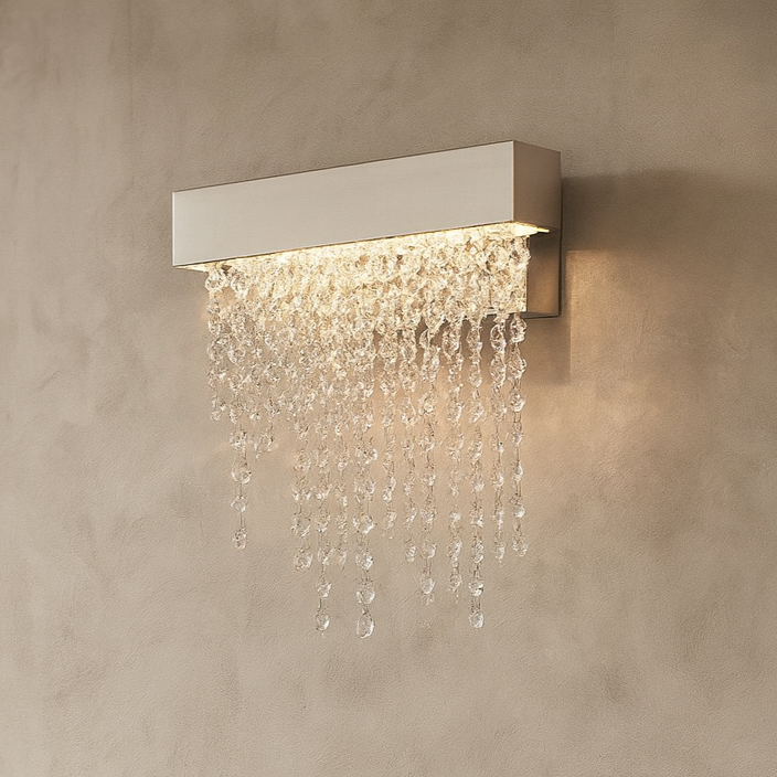 The Alleri Crystal Wall Sconce by Morsale.com features a sleek rectangular metallic base and cascading clear crystal beads, creating a waterfall effect—ideal as decorative accent lighting for your space.