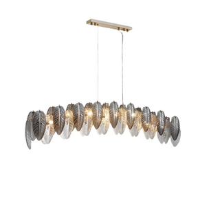 The Giatti Glass Dining Room Chandelier from Morsale.com showcases a contemporary design with a rectangular, gold-colored base. Two cords suspend an array of intricately crafted, metallic leaf-shaped lights, each featuring a silver finish and illuminated by LED bulbs. This sophisticated and elegant lighting fixture adds a touch of modern luxury to any space.