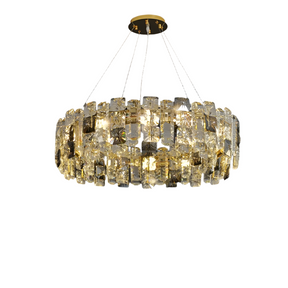 The luxurious Rimini Crystal Chandelier from Morsale.com features a circular design, suspended from the ceiling by multiple wires. Adorned with dazzling crystals that reflect light to create a sparkling effect, it adds an elegant touch to any dining room. The frame and attachment point are finished in gold.