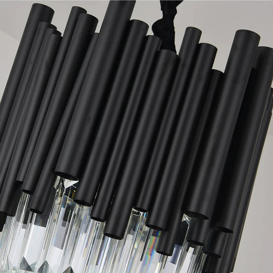 A close-up of the Vigo Kitchen Island Light Fixture by Morsale.com, showcasing black cylindrical rods and handmade clear crystals hanging below. The design is modern and geometric, featuring premium stainless steel combined with matte and reflective materials that create a striking visual effect—perfect for your kitchen island.