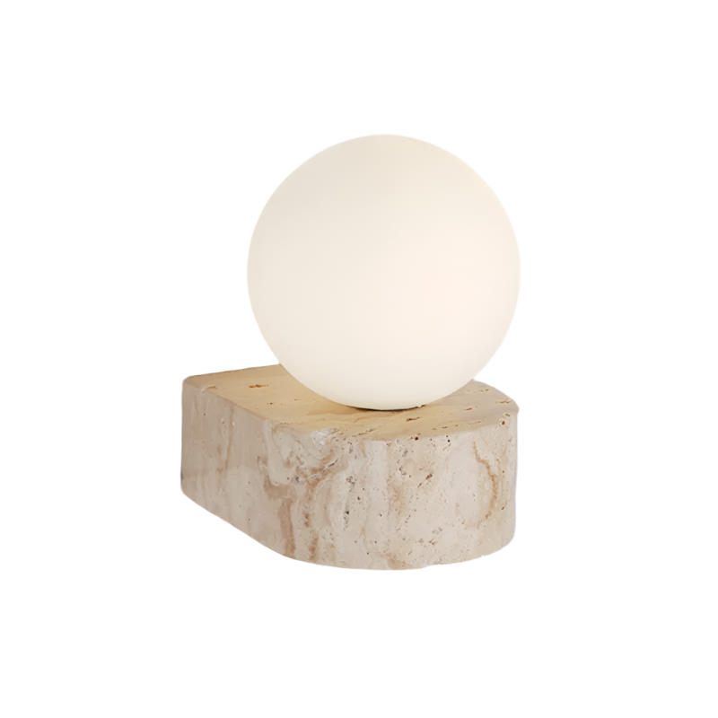 The Modern LED Travertine Wall Sconce from Morsale.com features a travertine base with natural beige and light brown patterns, topped with a large, smooth frosted globe light. Equipped with LED bulbs, the globe emits a soft, warm glow that casts gentle light on the wall.