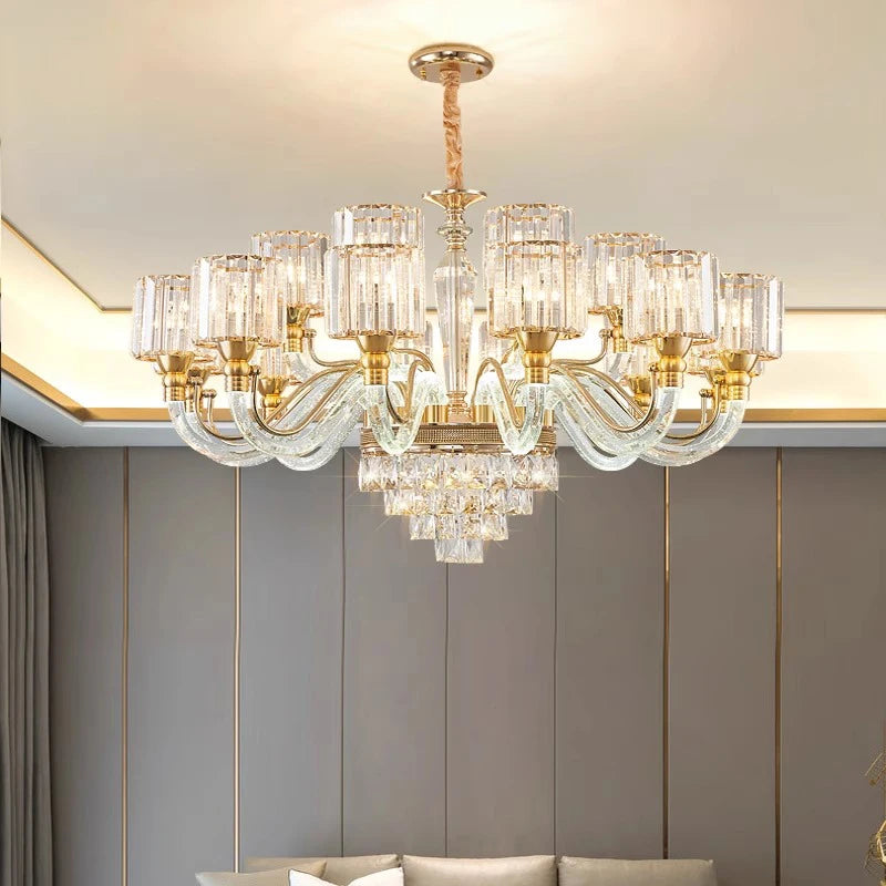 The Gio Crystal Contemporary Chandelier by Morsale exudes luxury with its multiple glass arms and gold accents. Each LED bulb is surrounded by cylindrical glass shades, creating an elegant and sophisticated ambiance in the room.