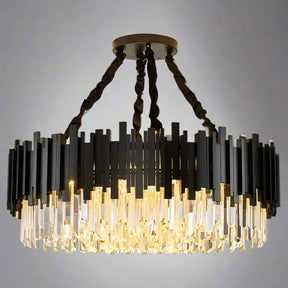 The Gio Modern Chandelier by Morsale features a contemporary circular design with staggered black and clear glass elements. It has a crystal shade suspended from a round ceiling mount with four twisted black cables, creating a warm glow.