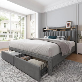 The spacious bedroom highlights a Morsale Verano Bed Frame with a large upholstered headboard featuring nailhead trim and storage drawers. Paired with a window view, stylish nightstand decor, and patterned rug, it completes the cozy setting.