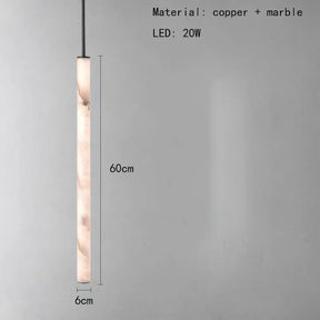 The Natural Marble & Brass Pendant Light Fixture by Morsale.com is a sleek, cylindrical pendant light crafted from polished brass and natural marble. It measures 60cm in height and 6cm in width, using a 20W LED bulb. The plain background accentuates the text that specifies the materials and wattage.